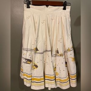 French Connections cream skirt with fish boat design size 10 fits more like a 4